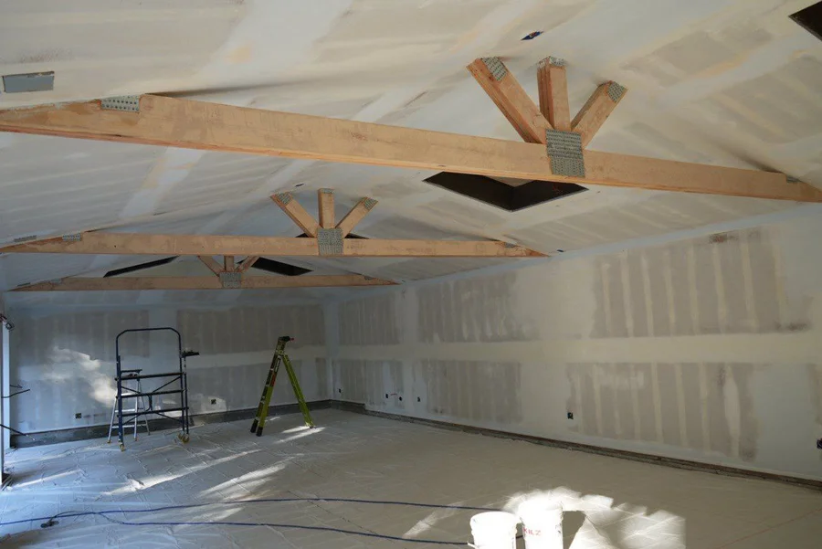 Contractor in parking lot with phone